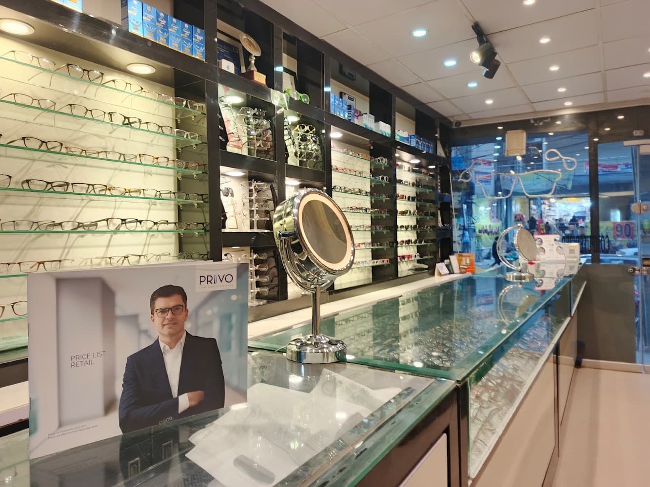 Inside the Danish Optics store in Rawalpindi — display shelves of eyeglasses and sunglasses